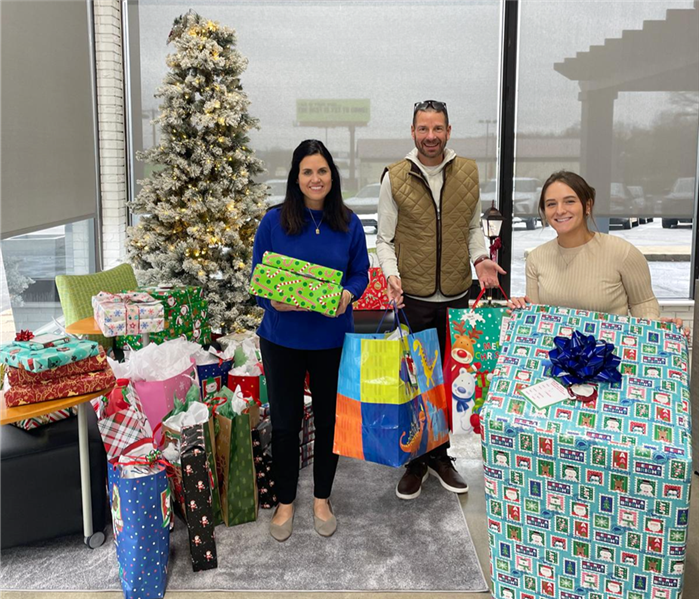 servpro team with presents for toys for tots