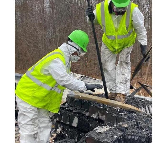 SERVPRO employees cleaning up fire